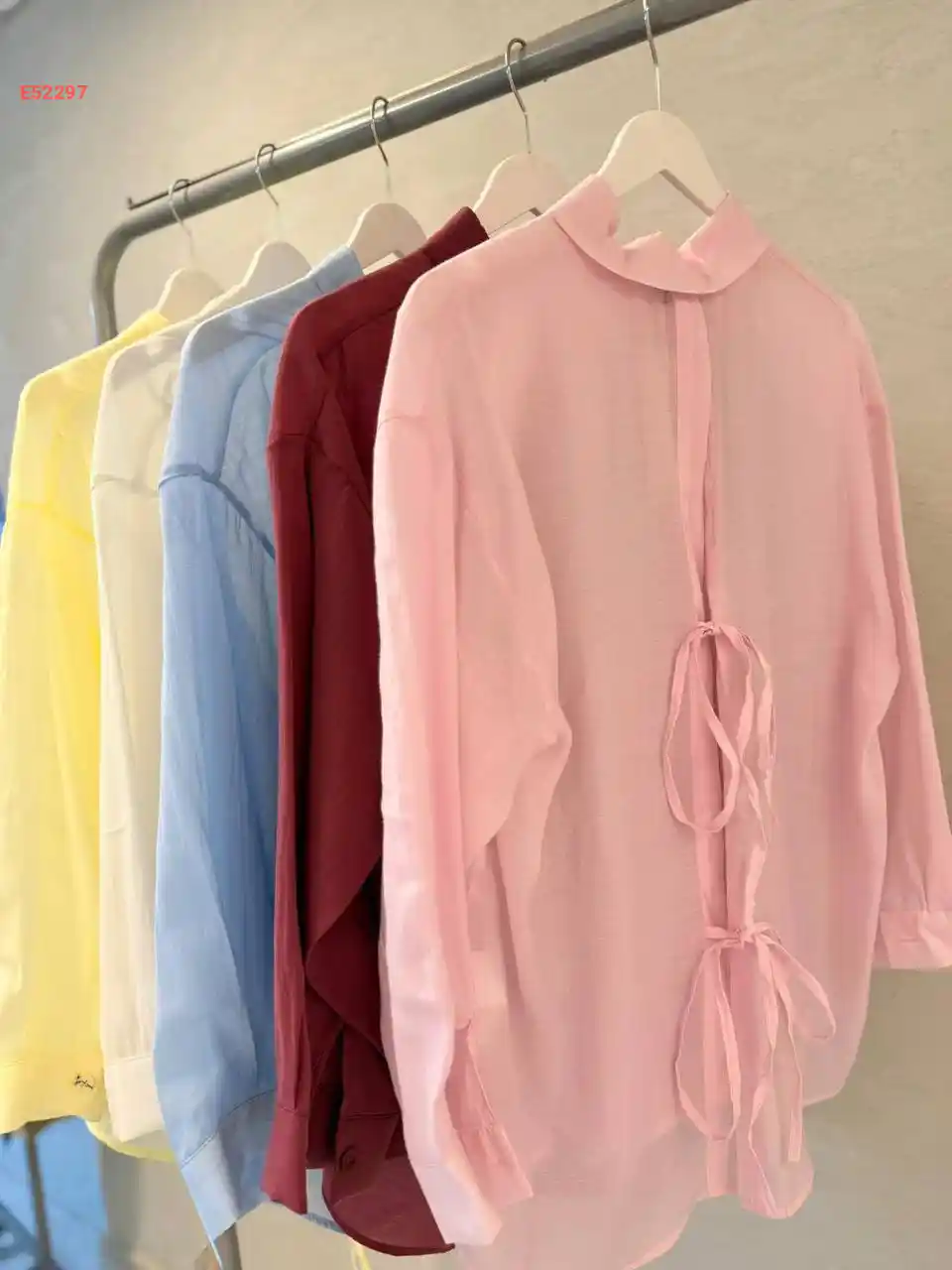 قميص كم طويل بربطات خلفية