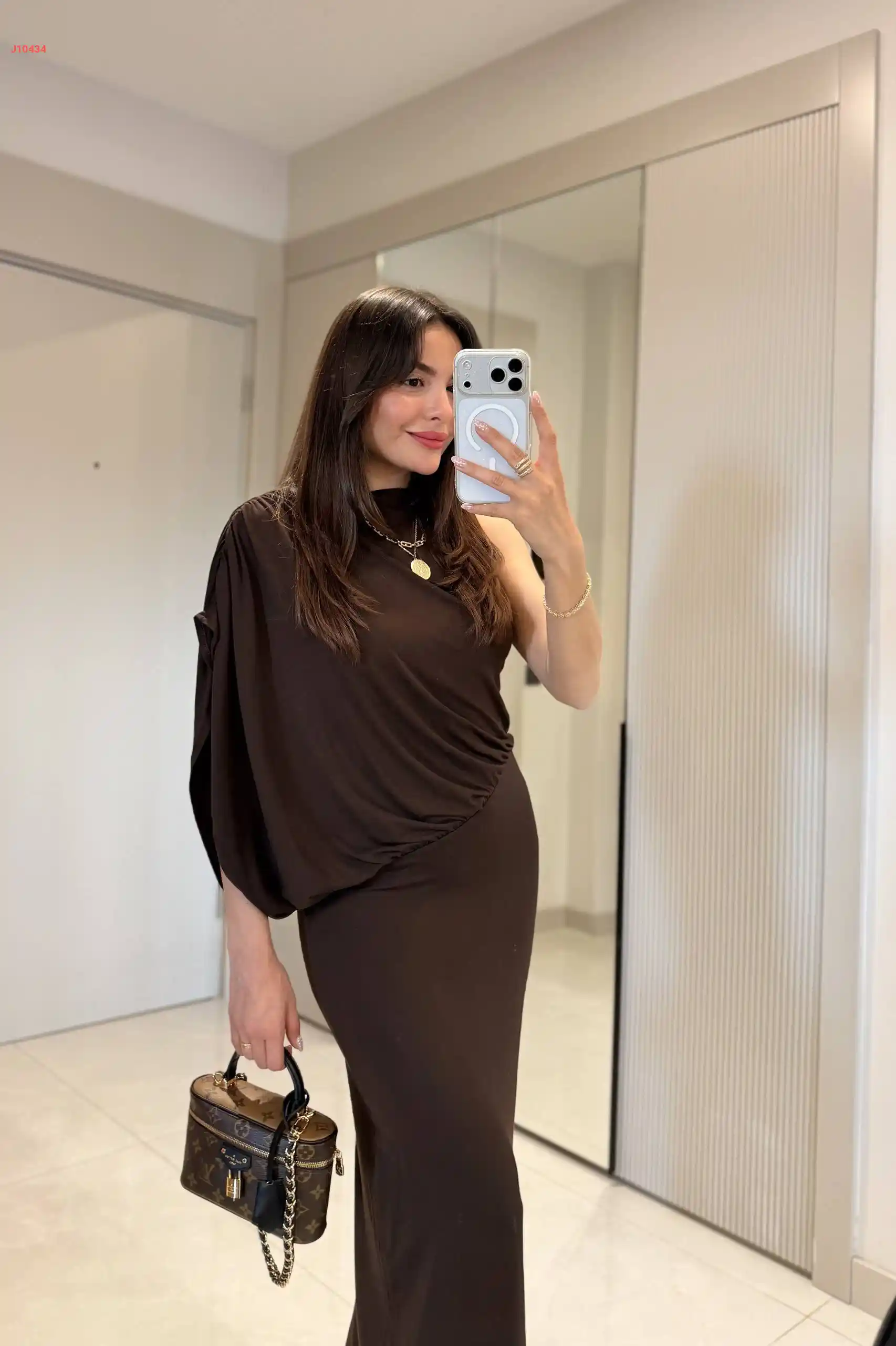 A long dress with gathered details.
